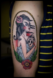 gypsy girl holding a skull with rope border